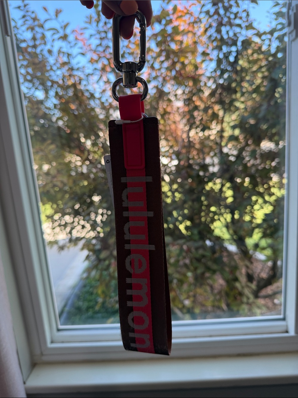 Lululemon never lost keychain word mark